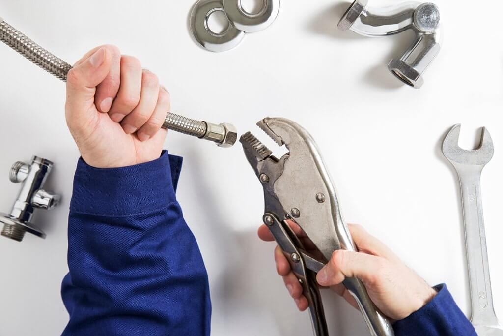 plumber performing plumbing repair